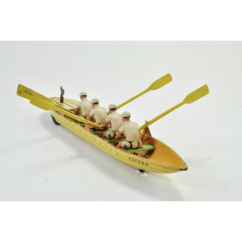 1190 - Scarce 1950's Clockwork Tinplate Rowing Team with Boat, depicting Oxford University (printed). Likel... 