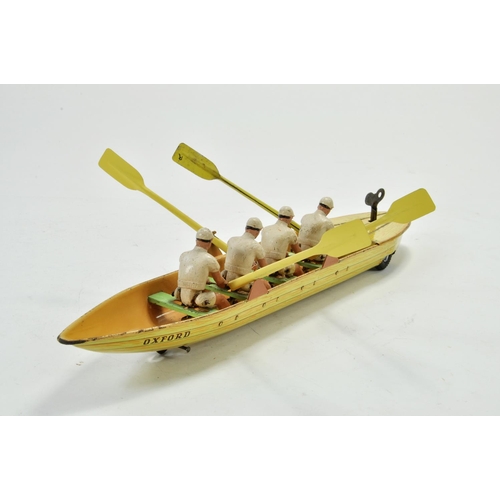 1190 - Scarce 1950's Clockwork Tinplate Rowing Team with Boat, depicting Oxford University (printed). Likel... 