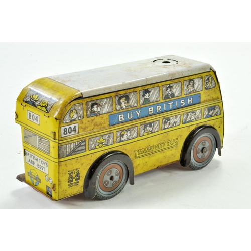 1193 - Wells (England) Clockwork Tinplate Trolley Bus in Yellow. Hard to find variation is incomplete, howe... 