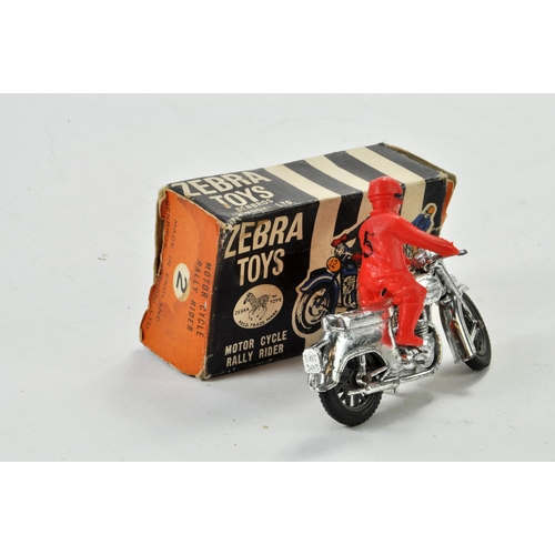 1296 - Benbros Zebra Toys Motorcycle Rally Rider comprising chrome bike and red plastic rider. Some wear he... 