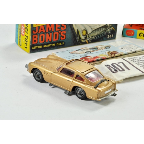 1319 - Corgi No. 261 James Bond Aston Martin DB5 from the film Goldfinger with gold body, red interior, Jam... 