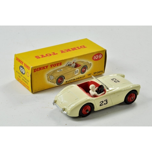 1362 - Dinky No. 109 Austin Healey 100 Sports in White with red interior and hubs, racing number 23 and dri... 