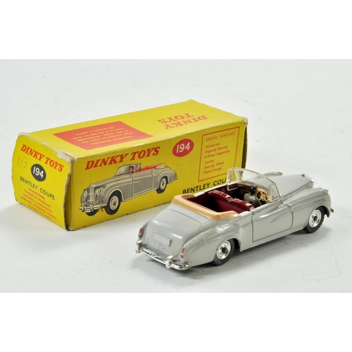 1388 - Dinky No. 194 Bentley Coupe in light grey, maroon interior, fawn hood and chrome spun wheels plus dr... 