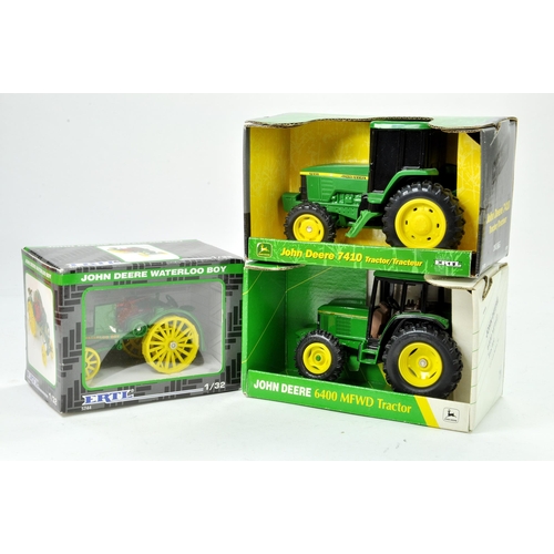 74 - Ertl Trio of 1/32 Farm Tractor issues comprising John Deere Waterloo Boy, 7410 and 6400. All general... 