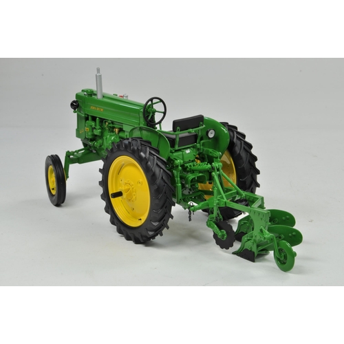 22 - Ertl Collector Edition 1/16 John Deere Model 40 Tractor with Plough. Has been on display, otherwise ... 