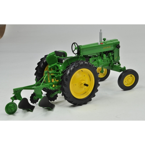 22 - Ertl Collector Edition 1/16 John Deere Model 40 Tractor with Plough. Has been on display, otherwise ... 