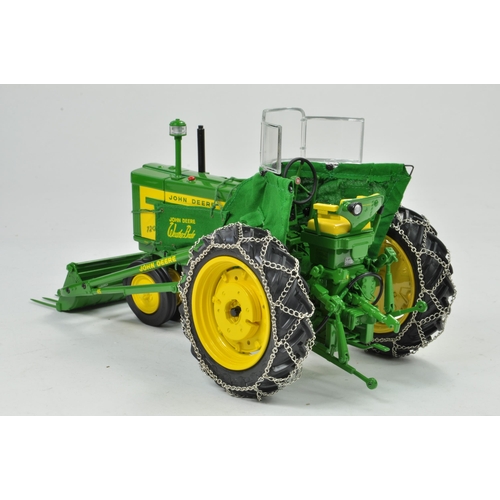 33 - Ertl Precision Series 1/16 John Deere 720 Tractor with 80 Blade and 45 Loader. Has been on display, ... 