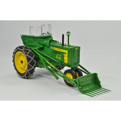 33 - Ertl Precision Series 1/16 John Deere 720 Tractor with 80 Blade and 45 Loader. Has been on display, ... 