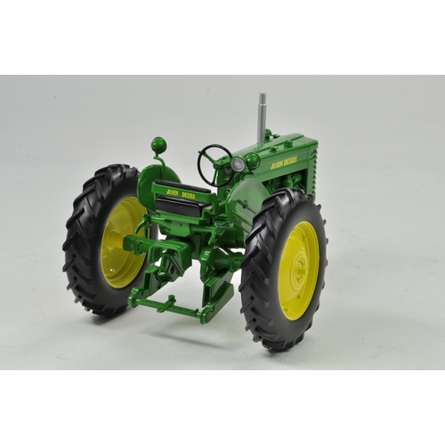 35 - Spec Cast 1/16 John Deere MT Gas Tricycle Tractor. Has been on display but appears excellent with or... 