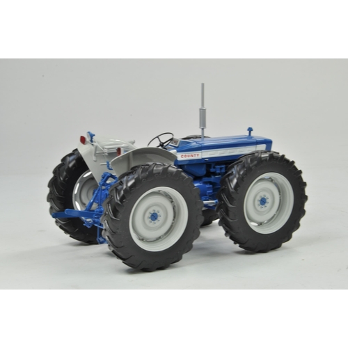 58 - Universal Hobbies 1/16 County 654 Tractor. Has been on display but appears excellent with original b... 