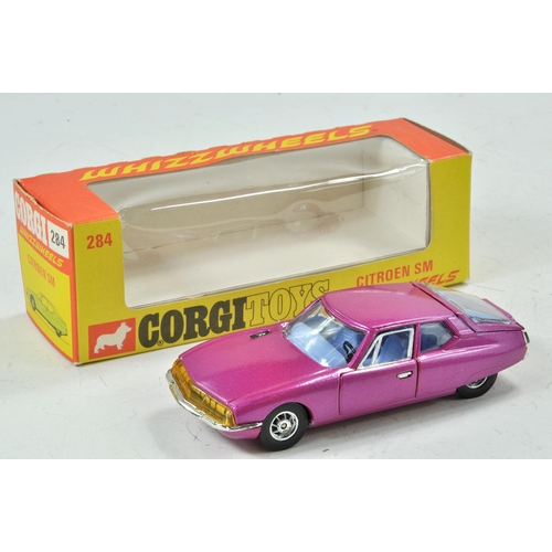 1575 - Corgi Toys 'Whizzwheels'. No. 284 Citro?on SM. Metallic Cerise body with pale blue interior. Spoked ... 