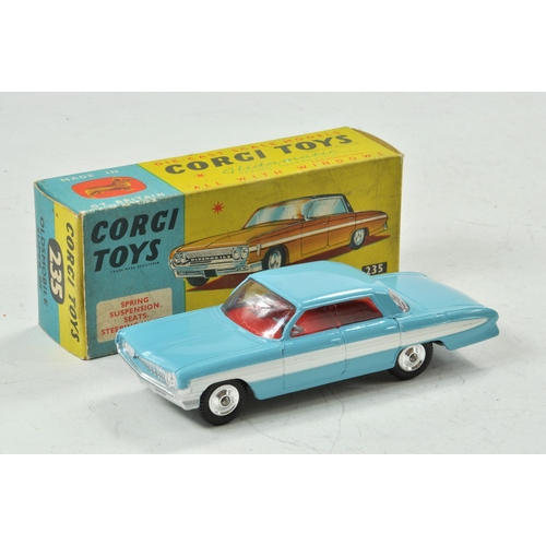 1595 - Corgi No. 235 Oldsmobile Super 88.  Light blue body with red interior. White side stripe flash. Spun... 