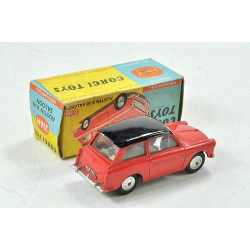 1564 - Corgi No. 216M Austin A40 with flywheel motor (works well). Red body with black roof. Grey base and ... 