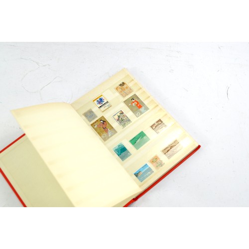 1506 - Stamps comprising a small album of Japanese issues, mid 20th century.