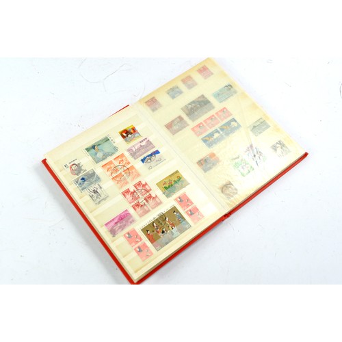 1506 - Stamps comprising a small album of Japanese issues, mid 20th century.