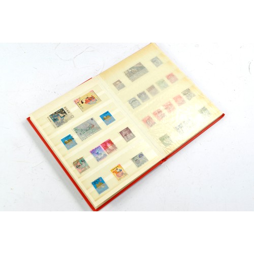 1506 - Stamps comprising a small album of Japanese issues, mid 20th century.