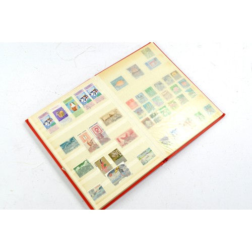 1506 - Stamps comprising a small album of Japanese issues, mid 20th century.