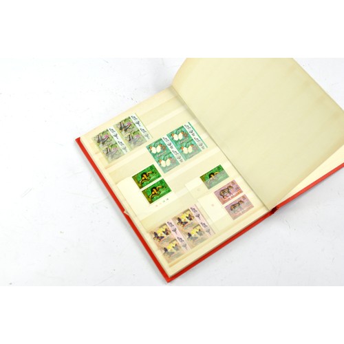 1506 - Stamps comprising a small album of Japanese issues, mid 20th century.