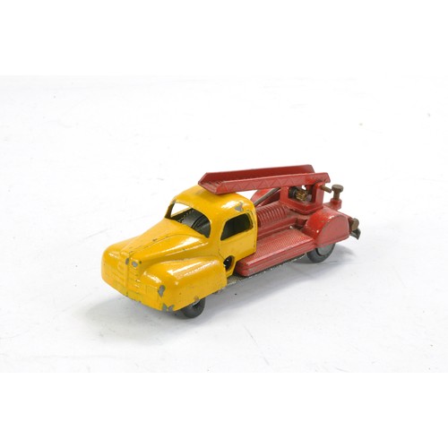 444 - Solido Clockwork Fire Engine. Red and Yellow. Fair with base cracked and general wear throughout but... 