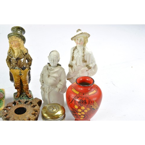 1581 - An intricate group of antique collectables comprising ornate figurines and bygones, including Shelle... 