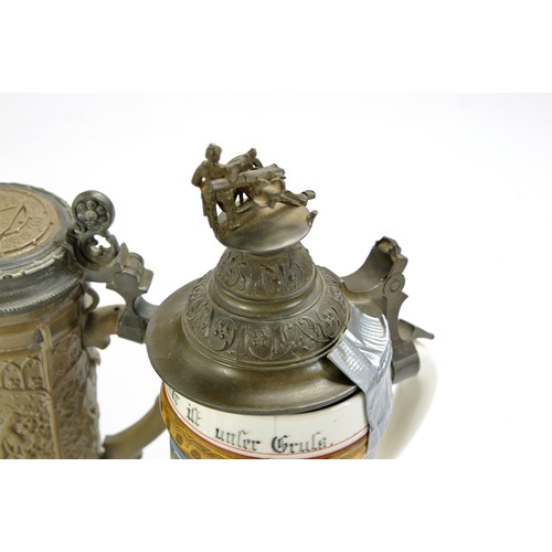 1588 - An elaborate decorative German ceramic stein with pewter lid and decoration plus one other both with... 