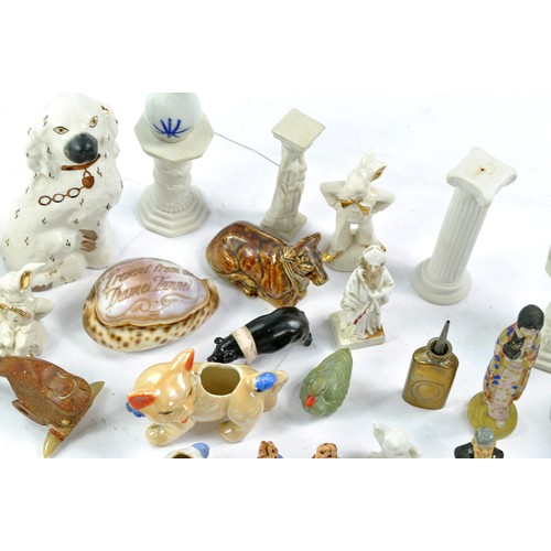 1592 - An eclectic group of vintage and antique miniatures comprising ceramic, metal and wooden themes. Var... 