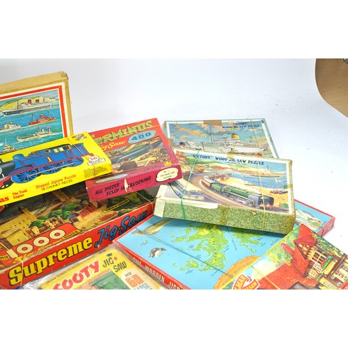 1567 - A group of vintage Victory Wooden Puzzles depicting various themes, Railway, Ships etc plus other in... 