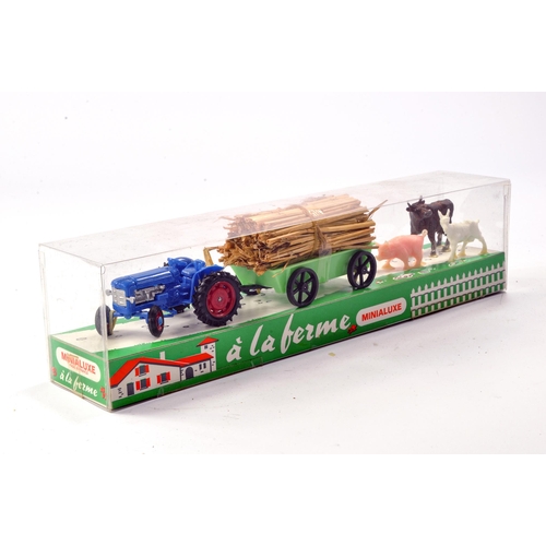 217 - Minialuxe (made in France) plastic farm set comprising Fordson Tractor and trailer plus animals. Exc... 