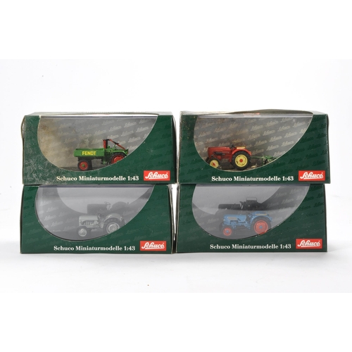 77 - Schuco group of Four 1/43 Tractor issues. Excellent in boxes, some boxes with storage wear.