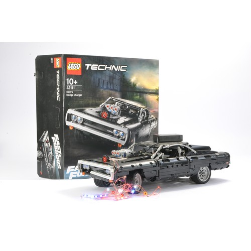 144 - Lego Technic comprising set no. 42111 Dom's Dodge charger. Set is built, but with front grill missin... 