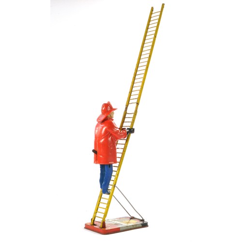 549 - Marx Mechanical Tinplate 'Climbing Fireman'. Good with obvious signs of wear but in working order. M... 