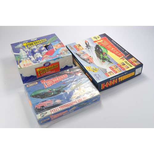 37 - Gerry Anderson interest comprising two complete sets from Matchbox for Thunderbirds, one looks seale... 