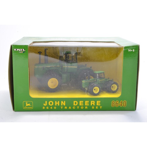 131 - Farm model interest comprising Ertl 1/32 and 1/64 John Deere 8640 Tractor set. Looks to be excellent... 