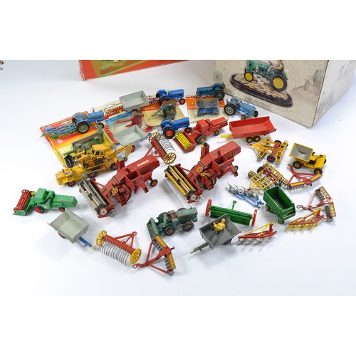 28 - A group of vintage Corgi diecast farm issues including Massey Ferguson Combine, Ford 5000 and implem... 