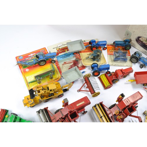 28 - A group of vintage Corgi diecast farm issues including Massey Ferguson Combine, Ford 5000 and implem... 