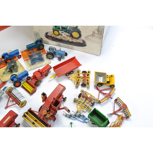 28 - A group of vintage Corgi diecast farm issues including Massey Ferguson Combine, Ford 5000 and implem... 