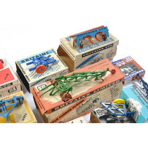 79 - A group of 7 Boxed Britains Farm Vintage Implement issues all in fair boxes but items very good to e... 