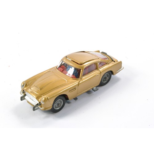 407 - Corgi No. 261 James Bond 007 Aston Martin DB5. Gloss 'Toffee' Gold with red interior and Light Tan e... 