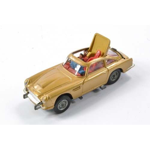 407 - Corgi No. 261 James Bond 007 Aston Martin DB5. Gloss 'Toffee' Gold with red interior and Light Tan e... 