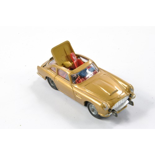 407 - Corgi No. 261 James Bond 007 Aston Martin DB5. Gloss 'Toffee' Gold with red interior and Light Tan e... 