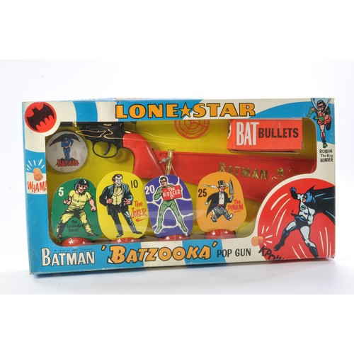 Lone Star 1966 Batman Batzooka Pop Gun. Secured in box, a complete and unplayed-with set which looks to be generally excellent without little sign of wear, some age related discolouration to batman badge. Contained in generally excellent box (considering type of box) with only minor (creasing and rubs )signs of wear.
