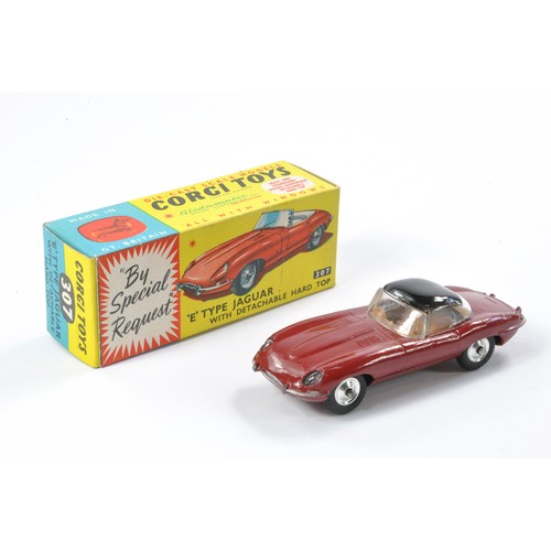 496 - Corgi No. 307 Jaguar E Type with detachable hard top. Maroon with brown interior, black hard top. Ge... 