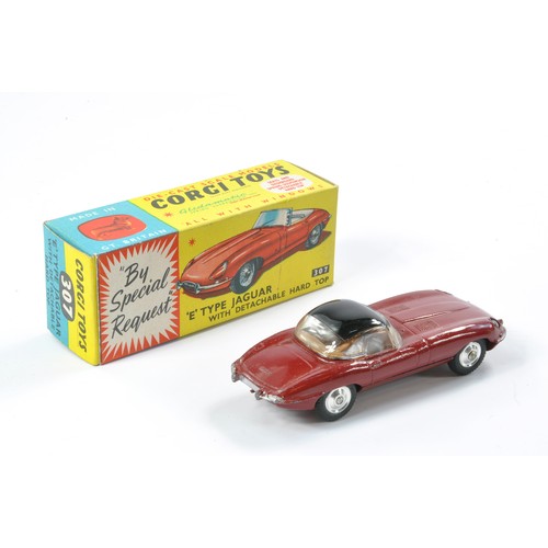 496 - Corgi No. 307 Jaguar E Type with detachable hard top. Maroon with brown interior, black hard top. Ge... 