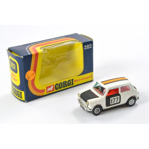 520 - Corgi No. 282 Mini Cooper. White and Black, red interior. Excellent with very little sign of wear in... 