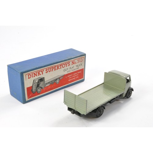 552 - Dinky No. 513 Guy Flat Truck with Tailboard. Grey with Black hubs. Generally excellent with very lit... 