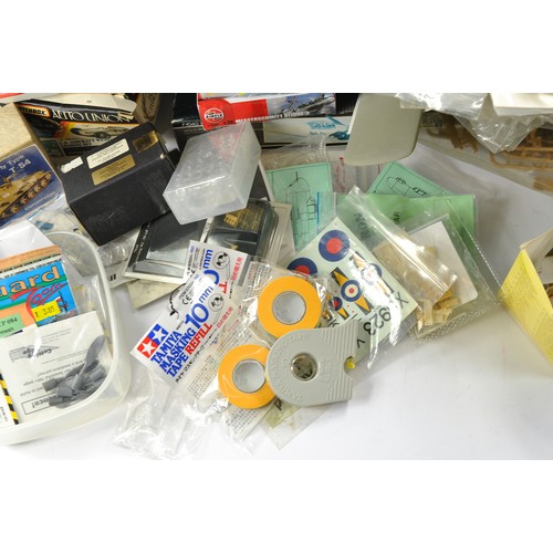 212 - An assortment of model kit parts and accessories including decals, resin conversion kits and other r... 