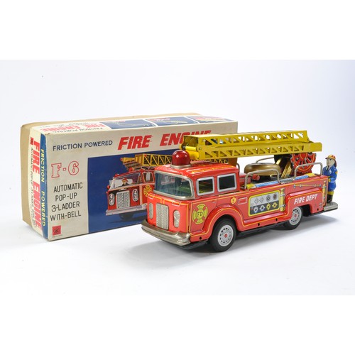 615 - Japanese Friction Driven Fire Engine. Looks to be complete and in working order with original box.