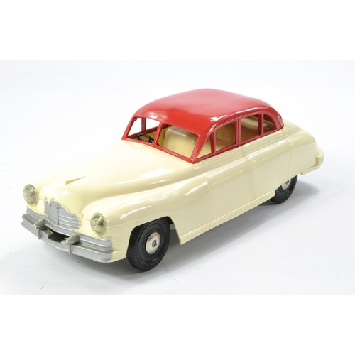 618 - Mettoy Plastic Friction Driven Saloon Car. Off White and Red. Generally very good in good working or... 