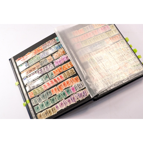 652 - Stamps, a large worldwide stamp album comprising used and unused issues dating throughout the 20th c... 