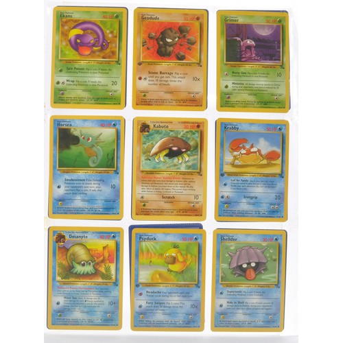 228 - Pokemon Cards comprising Fossil Series - 53/62 cards. Sealed within binder sheets as shown.